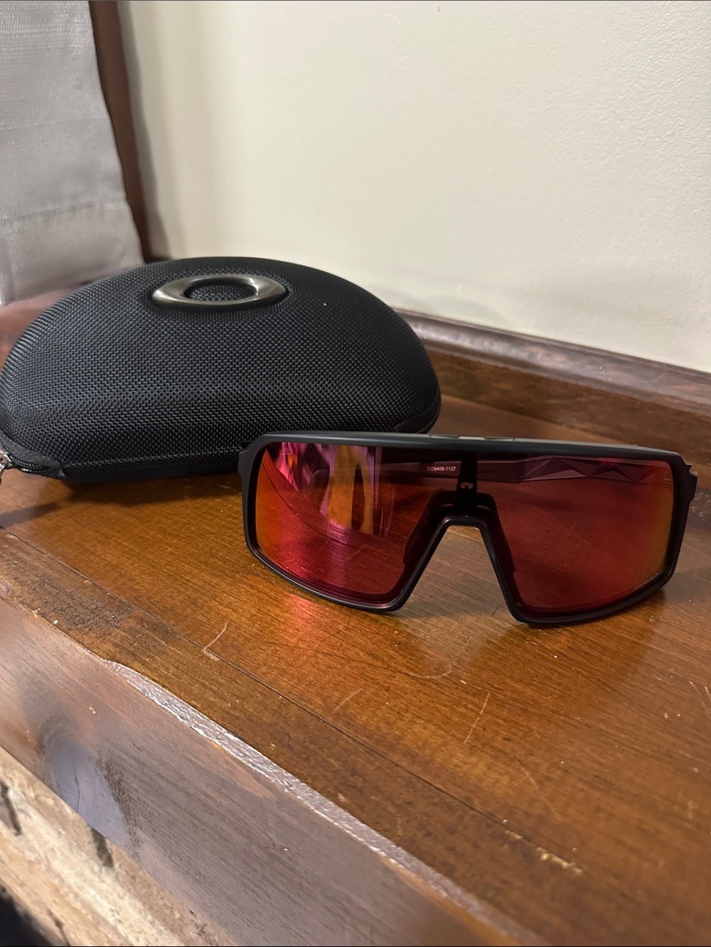 Oakley Sutro Black Frame Sunglasses with Red Mirrored Lens